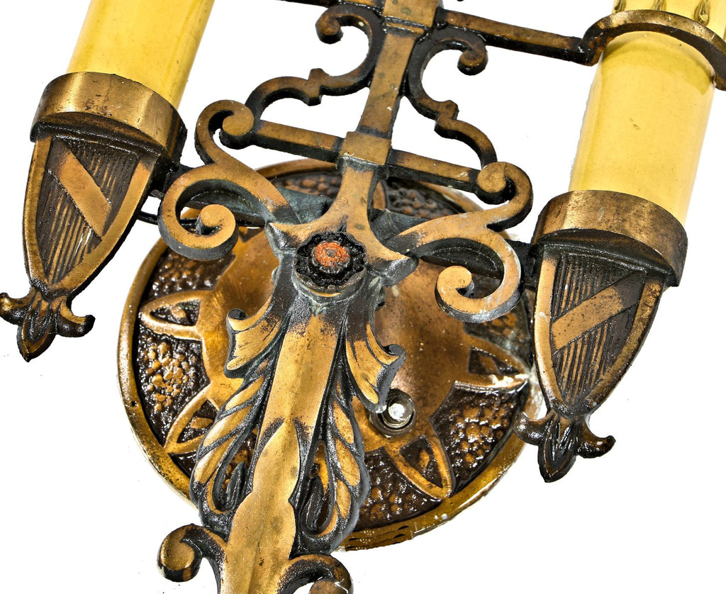 matching pair of original well-maintained spanish revival style ornamental cast brass interior residential double arm wall sconces