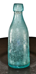 original and intact antique american c. 1870's irridized light blue aqua glass soda bottle fabricated for chicago bottlers the hausburg bros. and dug from a chicago area privy pit.