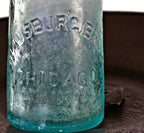original and intact antique american c. 1870's irridized light blue aqua glass soda bottle fabricated for chicago bottlers the hausburg bros. and dug from a chicago area privy pit.