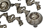 four matching original and completely intact refinished ornamental cast iron druggists' cabinet drawer pulls with centrally located keyholes