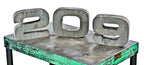 exterior pressed and folded vintage american industrial "209" address number sign salvaged from the facade of the osborne and adams building during its demolition