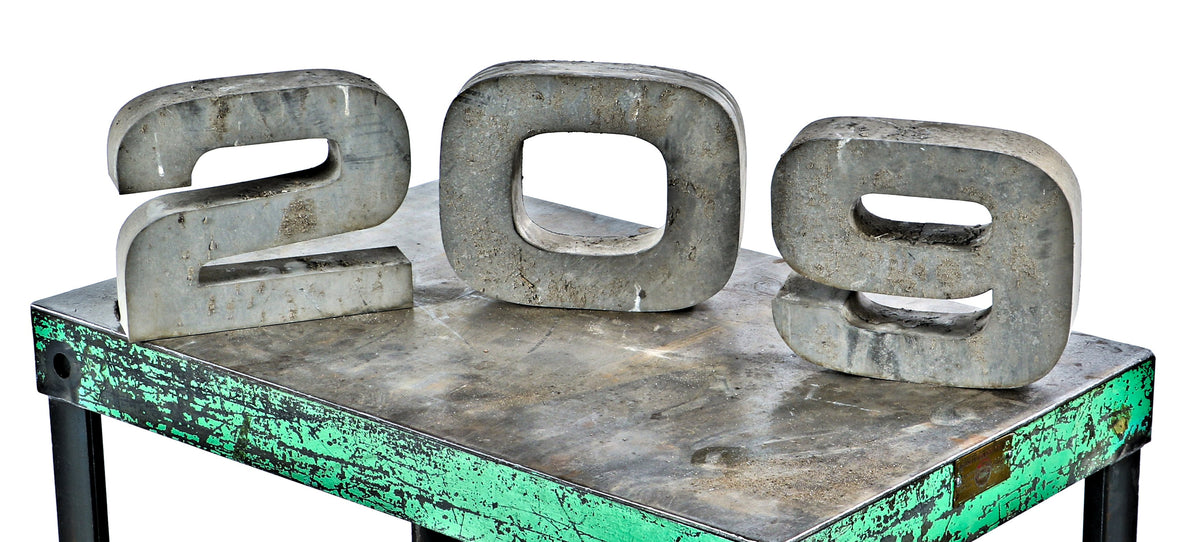 exterior pressed and folded vintage american industrial "209" address number sign salvaged from the facade of the osborne and adams building during its demolition
