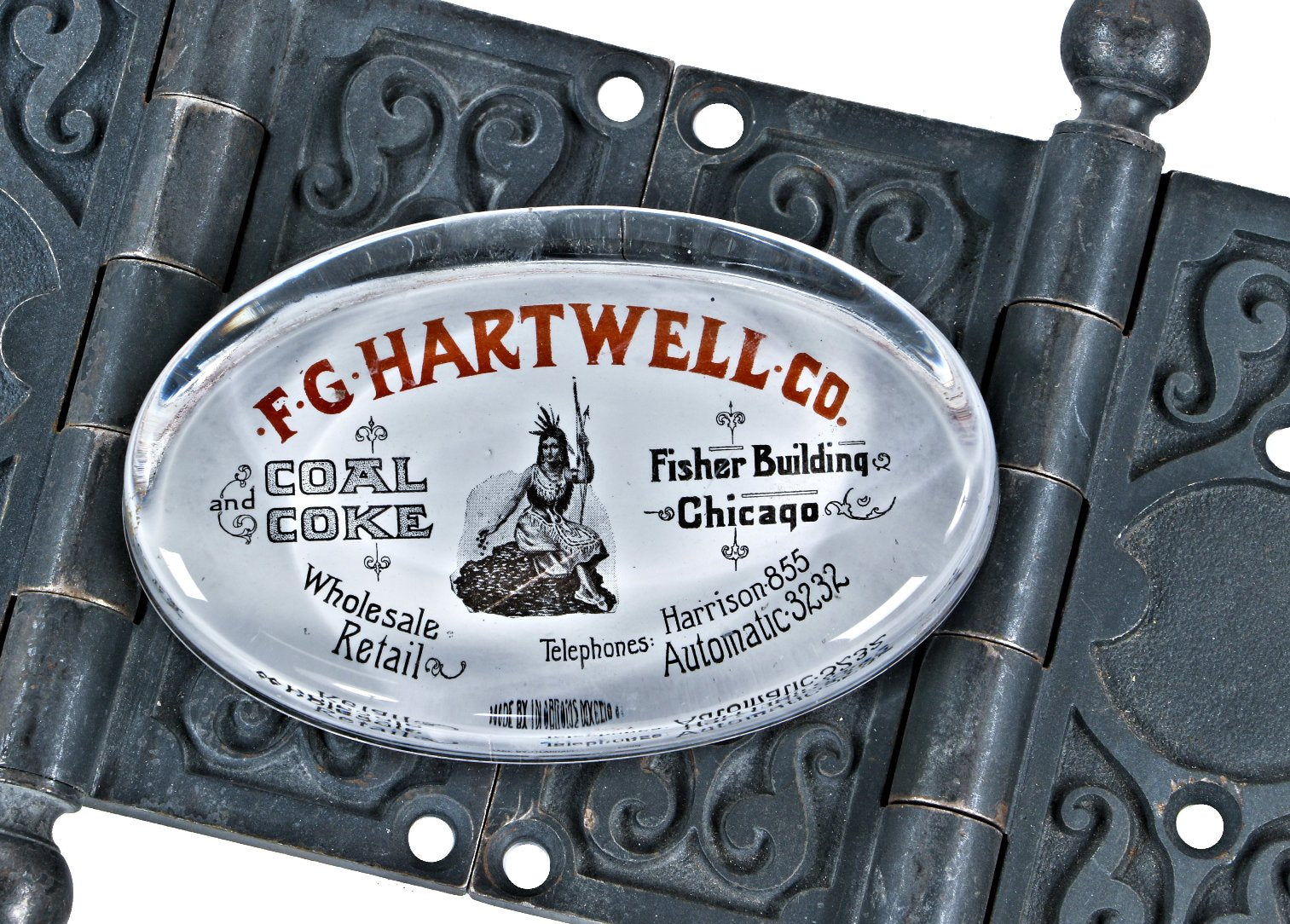 c. 1900's antique american coal and coke supplier f.g. hartwell company libbey weighted glass fisher building paperweight with native american resting on a pile of coal