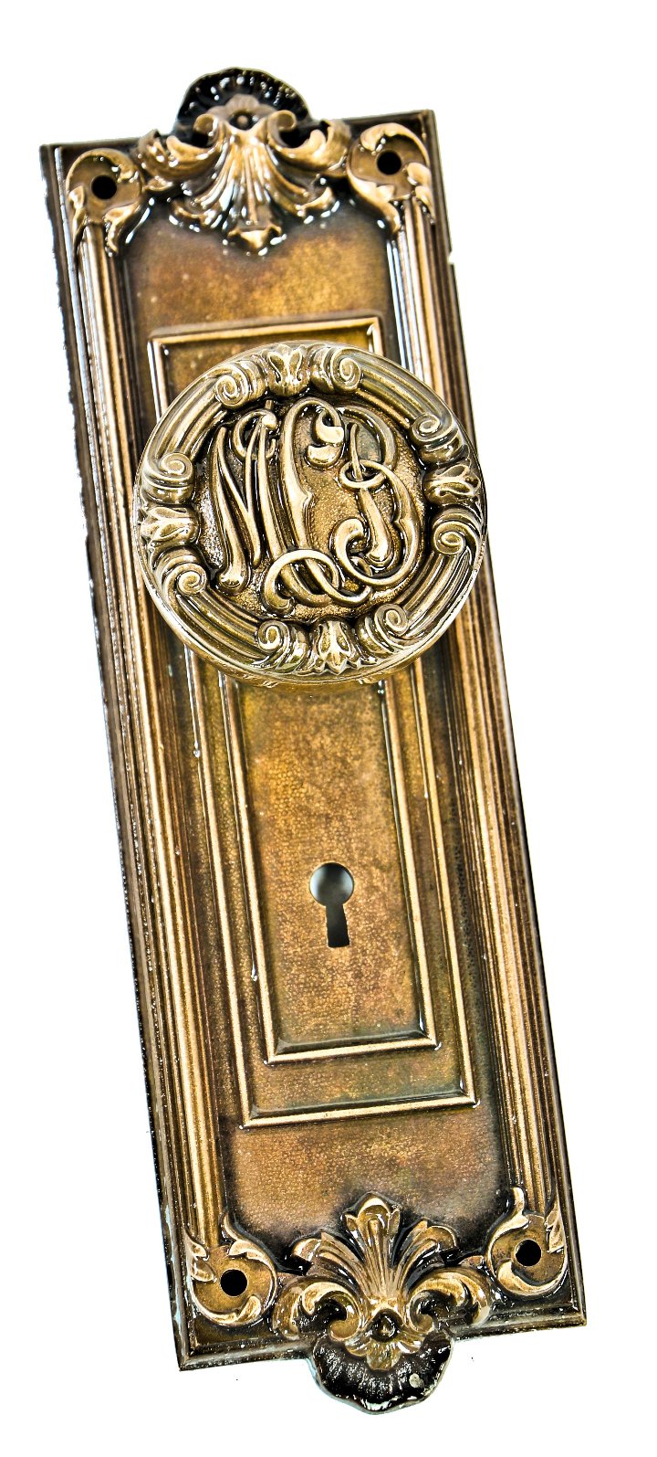 original early 20th century ornamental cast bronze monogrammed "mcb" mccormick doorknob with matching backplate salvaged from the roanoke building and tower
