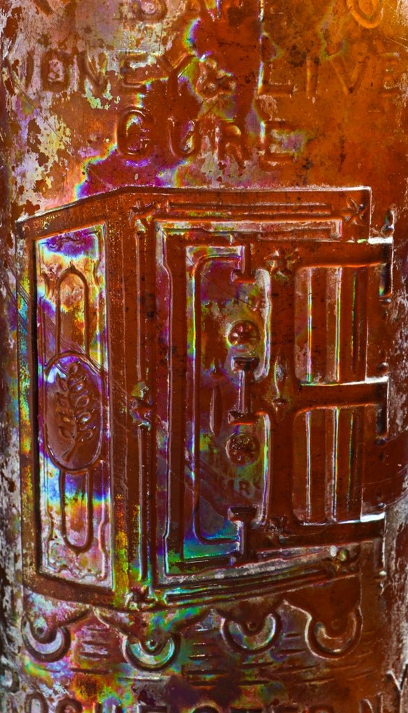 intact late nineteenth century chicago privy-dug amber flask shaped medicine bottle of "warner's safe kidney cure" manufactured for hulbert harrington warner