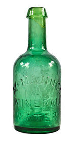 very rare original and largely intact mid-1840's american "mcmanus's mineral water" early soda bottle with heavy whittling and open-pontiled base