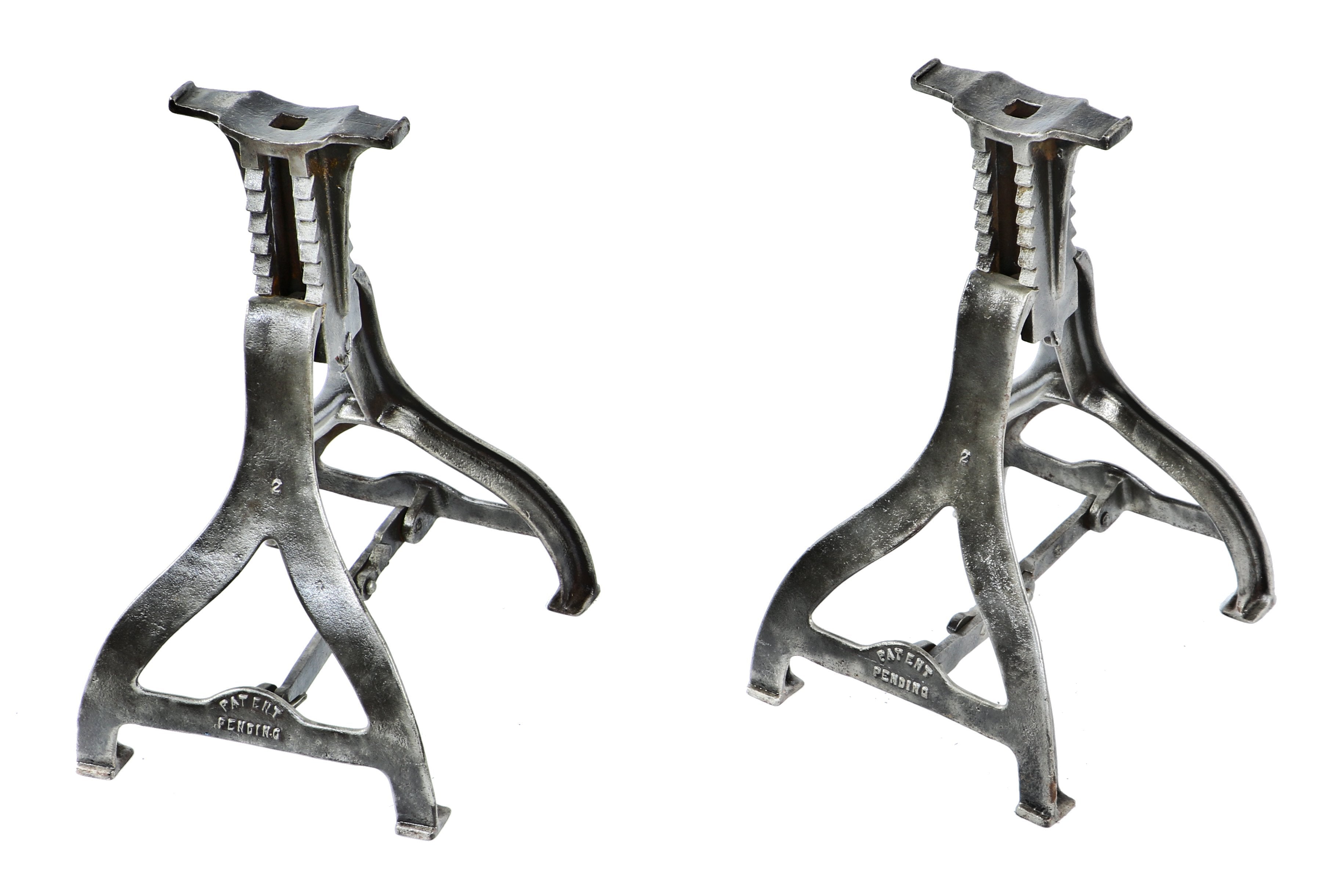 matching set of antique american industrial patented early 20th century durable four-legged reinforced cast iron telescoping jack stands with brushed metal finish