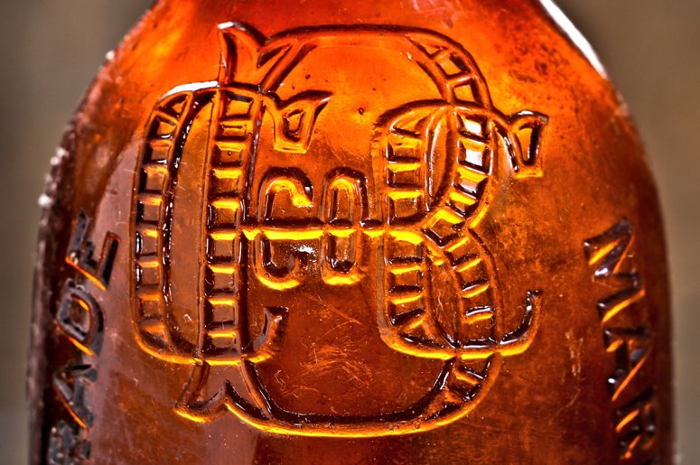 hard to find late nineteenth century privy dug and intact amber blobtop bottle fabricated for the chicago consolidated bottling company