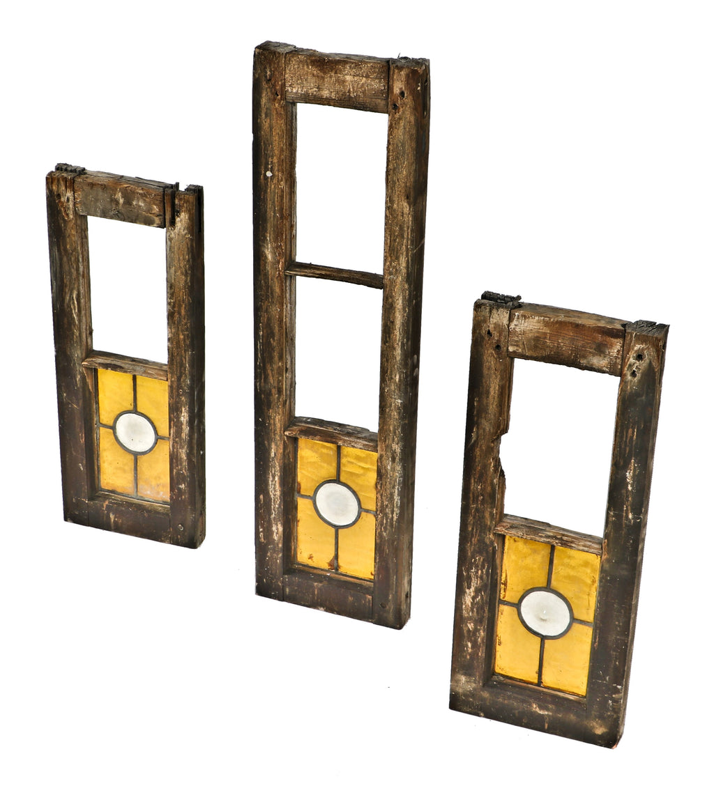 set of three worn and weathered partially intact late 19th century adams street church original art glass windows with amber cathedral roll glass surrounding oversized opalescent rondels