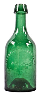 rare and all original antique mid-nineteenth century dark emerald green glass pontiled soda or mineral water bottle manufactured by the dyottville glassoworks in philadelphia.