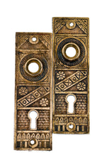 two original and intact 19th century antique american eastlake style ornamental cast brass doorknob escutcheons or backplates with nicely aged surface patina