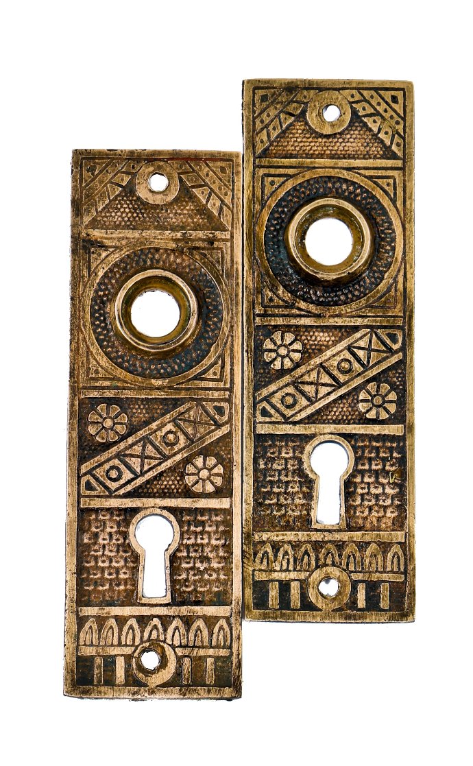 two original and intact 19th century antique american eastlake style ornamental cast brass doorknob escutcheons or backplates with nicely aged surface patina