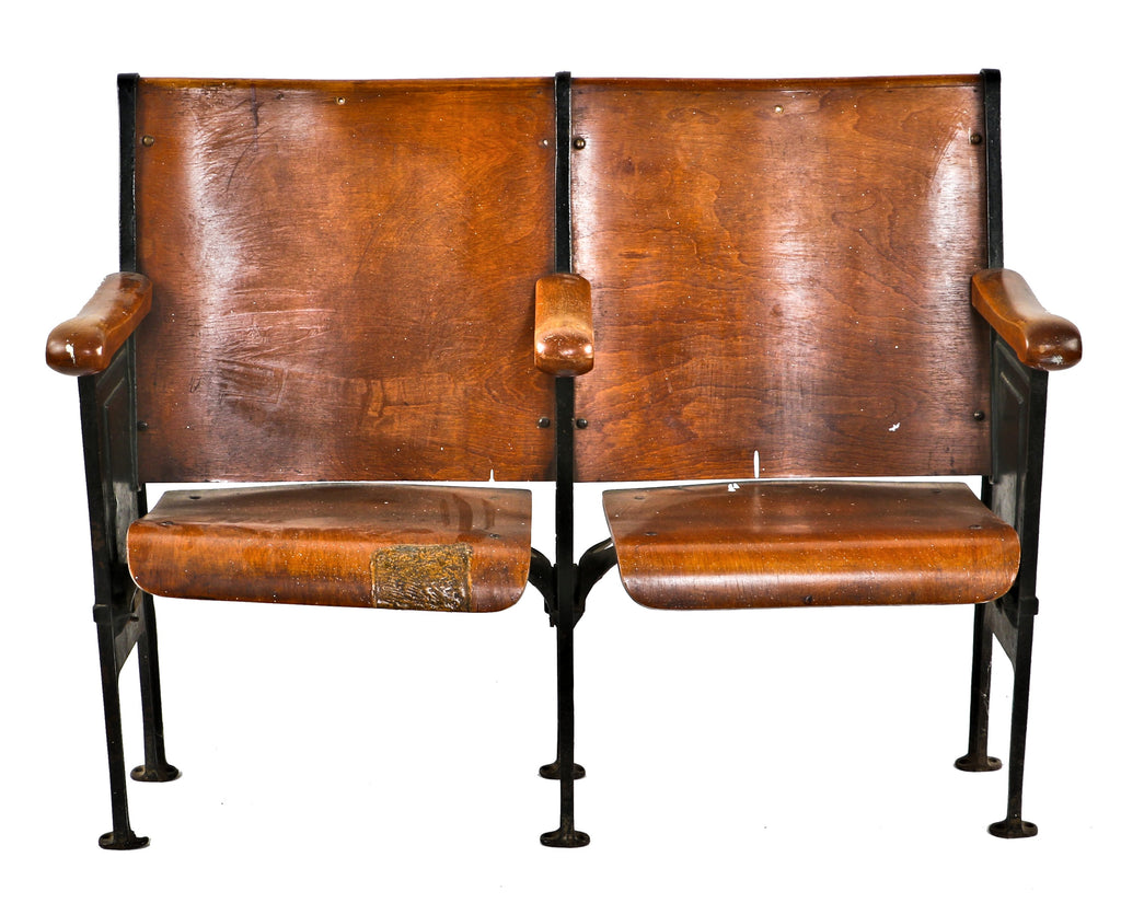 well-maintained all original c. 1920's antique american ornamental cast iron double-seat theater style chairs with stained birch wood seats and backrests