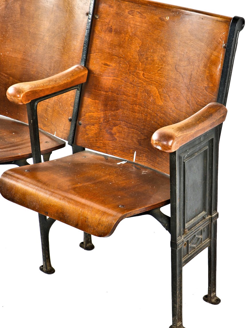 well-maintained all original c. 1920's antique american ornamental cast iron double-seat theater style chairs with stained birch wood seats and backrests