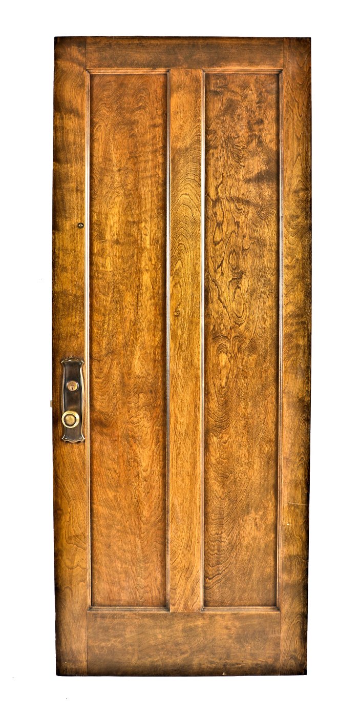 robust early 20th century double-panel original and intact varnished birch wood chicago apartment door with intact pressed yellow brass hardware