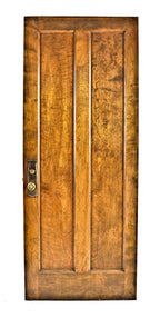 robust early 20th century double-panel original and intact varnished birch wood chicago apartment door with intact pressed yellow brass hardware