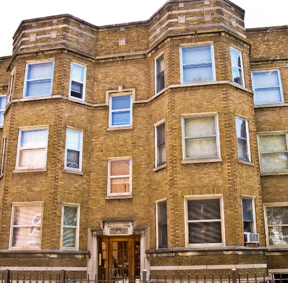 single all original and intact interior residential salvaged chicago double panel varnished birch wood apartment building door with pressed glass doorknobs