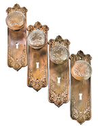 group of original late 19th or early 20th century antique america stamped steel "loriane" pattern interior residential passage door backplates and handles with largely intact plated finish
