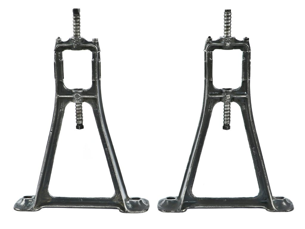 matching set of original early 20th century heavily reinforced cast iron ceiling-mount factory machine shop line shaft pulley brackets with a uniform brushed metal finish