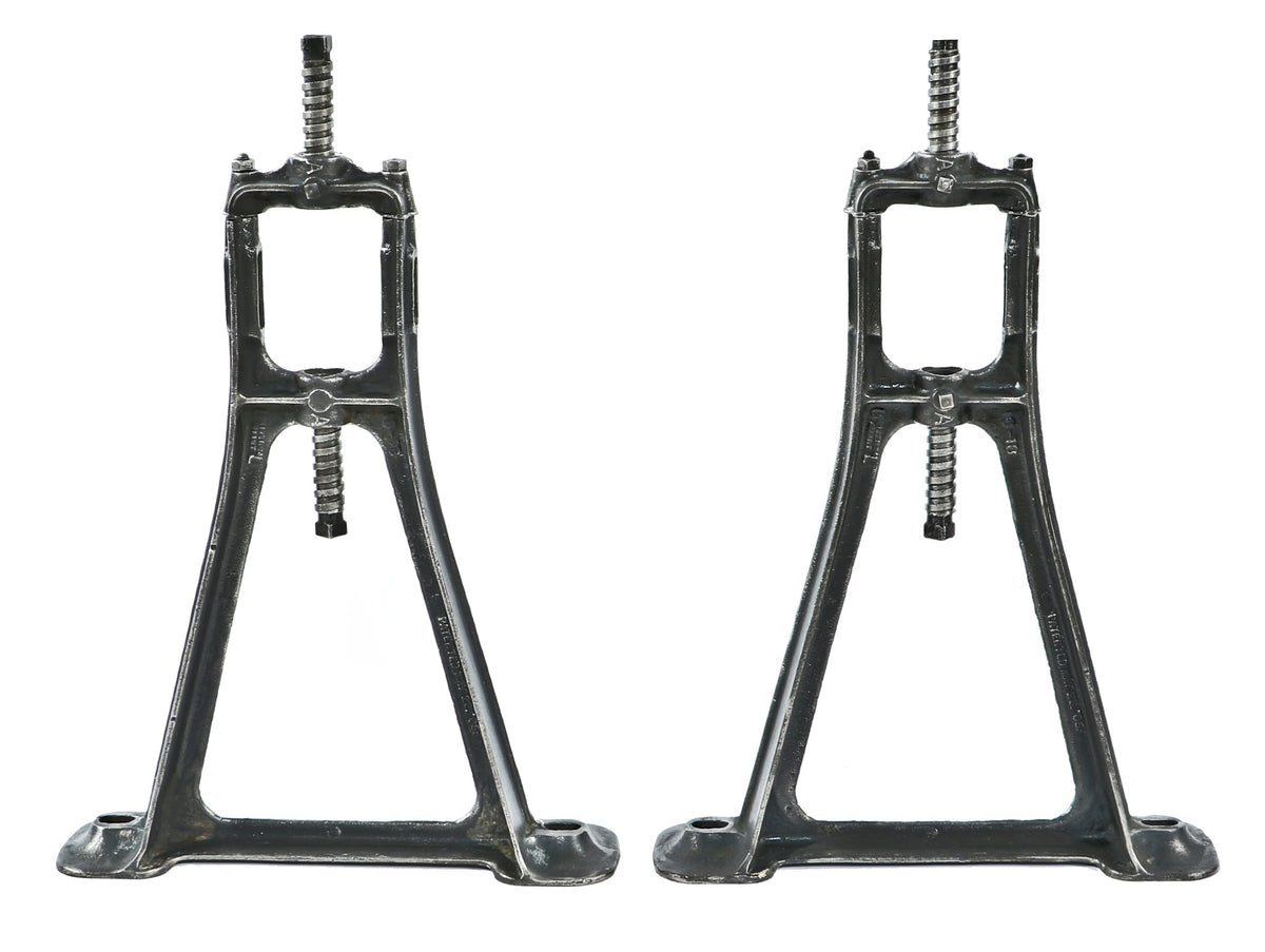 matching set of original early 20th century heavily reinforced cast iron ceiling-mount factory machine shop line shaft pulley brackets with a uniform brushed metal finish