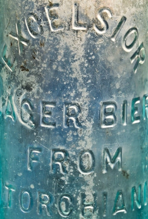 hard to find all original and completely intact antique late nineteenth century aqua blue glass "excelsior lager beer" fabricated for h. torchiani and dug from a chicago area privy pit.