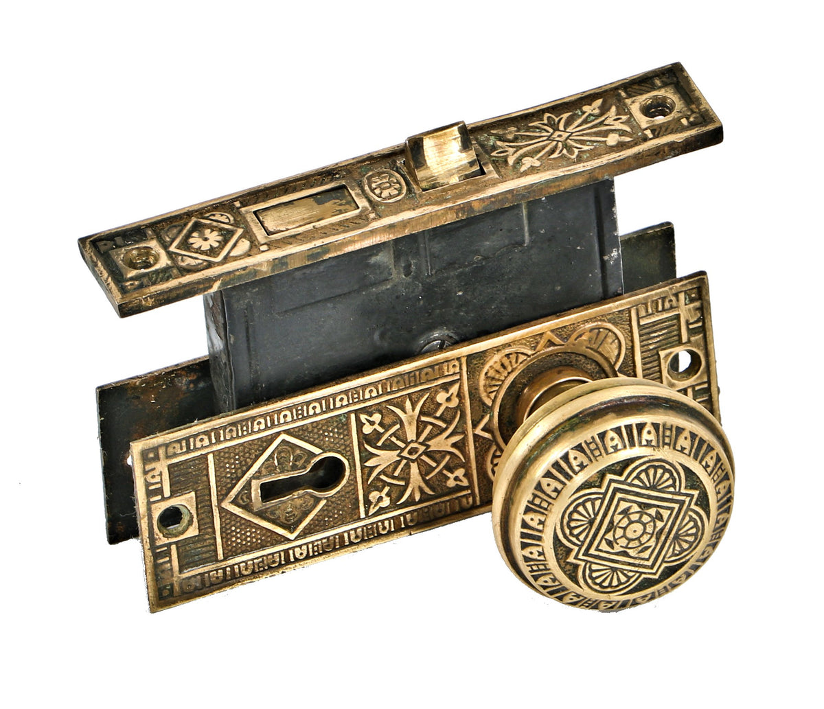 original and intact c. 1880's eastlake style ornamental cast brass matching salvaged milwaukee residential passage door mortise lock with backplates and doorknobs