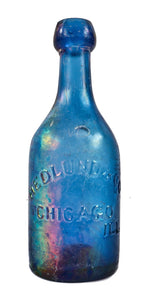 original antique american mid-nineteenth century irridized cobalt blue glass iron-pontiled soda bottle fabricated for john hedlund & company in chicago, ills.