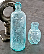 rare and all original privy dug oversized unearthed chicago tall aqua cylindrical medicinal "moxie" beverage bottle with applied top