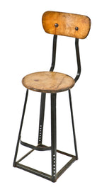 depression-era antique american industrial reinforced four-legged riveted joint stationary factory machine shop stool with original maple backrest and circular seat