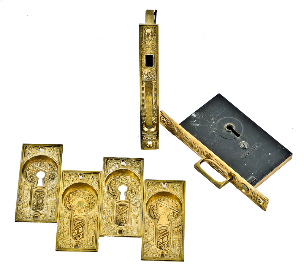 completely intact 19th century highly desirable ornamental cast brass eastlake style "ceylon" pattern interior residential pocket door hardware with matching mortise locks