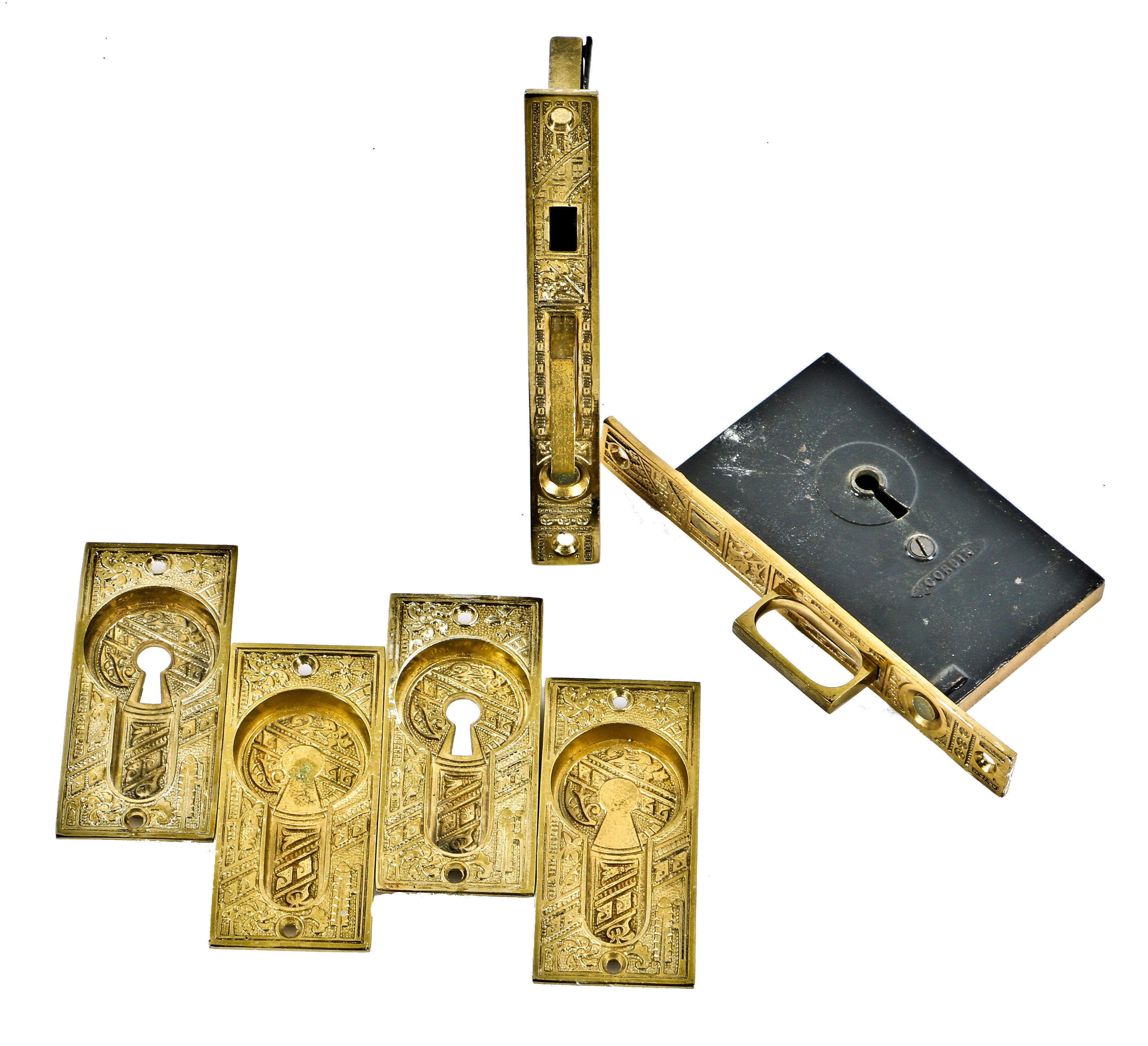 completely intact 19th century highly desirable ornamental cast brass eastlake style "ceylon" pattern interior residential pocket door hardware with matching mortise locks