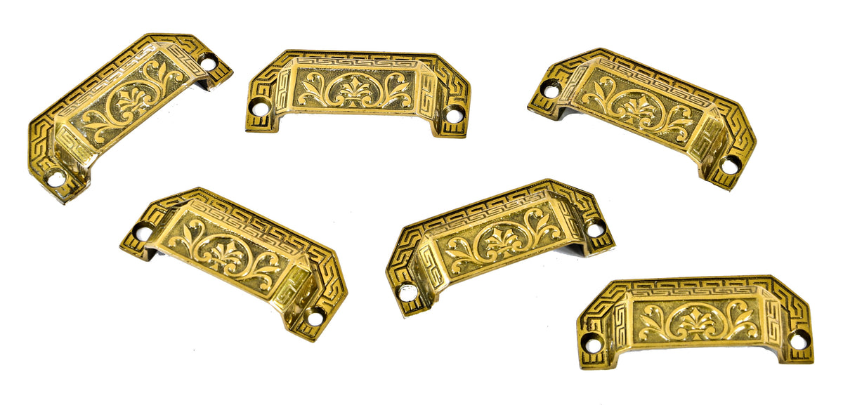 group of original 19th century ornamental cast brass interior residential pantry cabinet drawer pulls with distinctive neo-grec border and centrally located palmettes