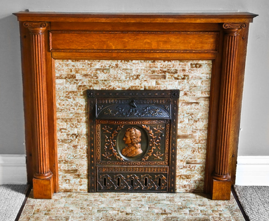 very clean and well-maintained late 19th or early 20th century antique american ornamental copper-plated stamped steel figural dawson fireplace gas insert