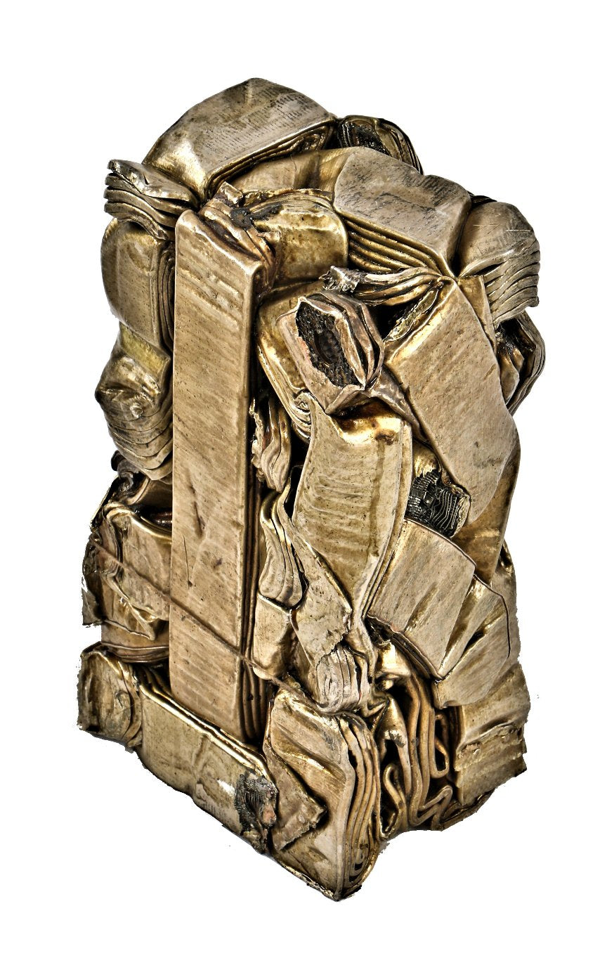 visually distinctive and incredibly heavy single crushed brass metal "briquette" display object consisting of recycled radiator components and/or piping