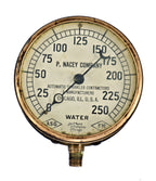 single lightly refinished antique american early 20th century crane brothers factory steam pressure gauge designed and fabricated for the p. nacey company in chicago, il.