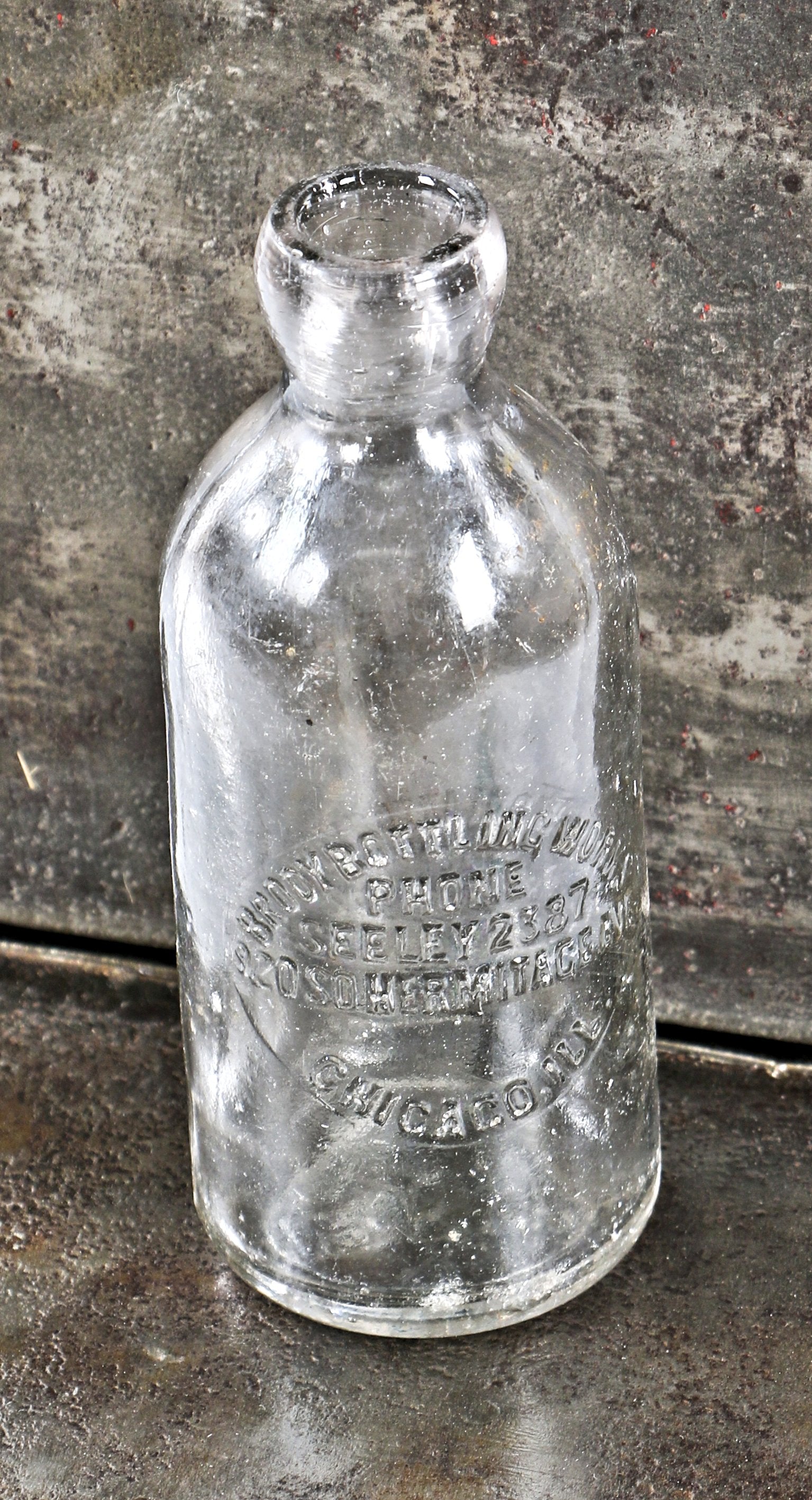 rare and all original antique american early twentieth century colorless glass hutchinson style beer or mineral water bottle fabricated for brody bottling works.