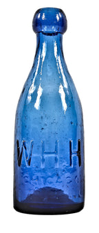 rare and highly collectible antique mid-nineteenth century cobalt blue glass blobtop soda bottle fabricated for chicago bottling giant william henry hutchinson.
