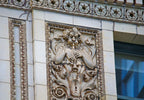 all original and intact "old ivory" glazed exterior historically important chicago theater terra cotta panels with centrally located opening for light bulb
