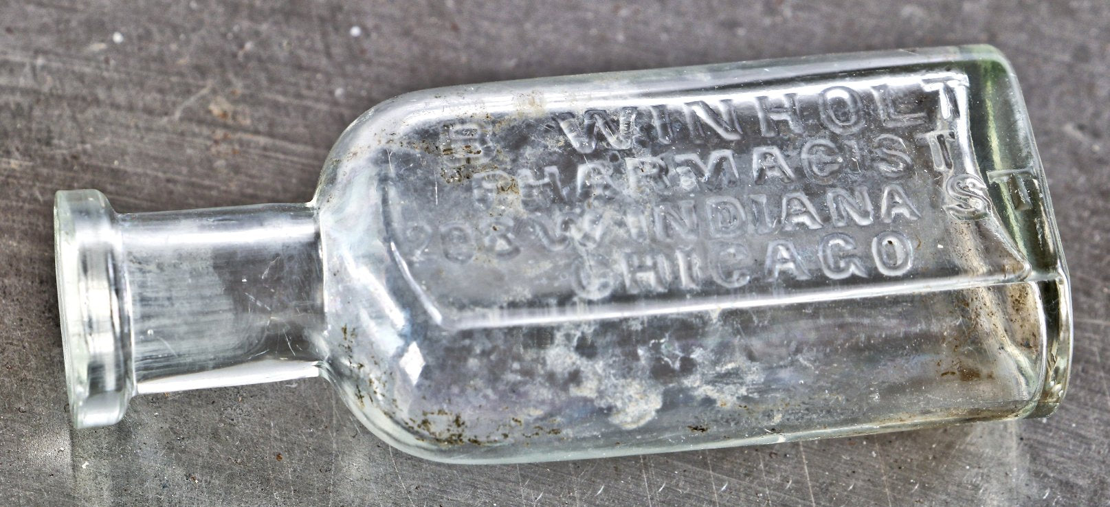 original and intact late 19th century chicago privy dug hand blown colorless glass medicine bottle fabricated for pharmacist boie winholt in chicago, il.