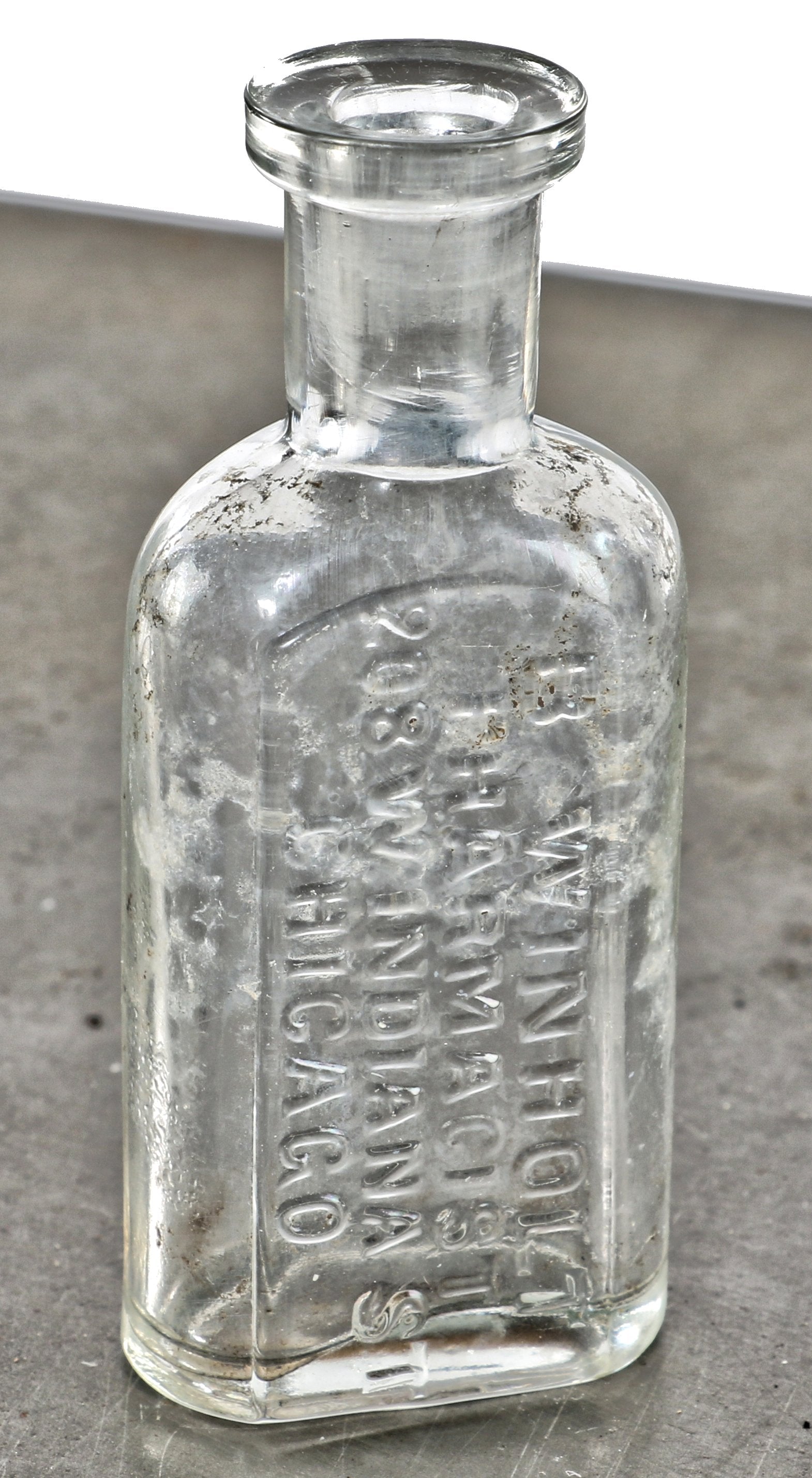 original and intact late 19th century chicago privy dug hand blown colorless glass medicine bottle fabricated for pharmacist boie winholt in chicago, il.