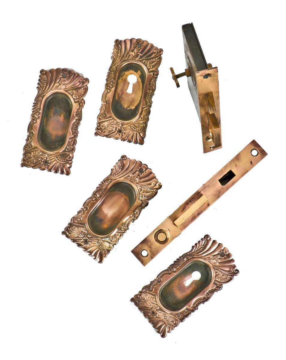 original 19th century ornamental wrought brass salvaged chicago "roanoke" pattern pocket door set with key