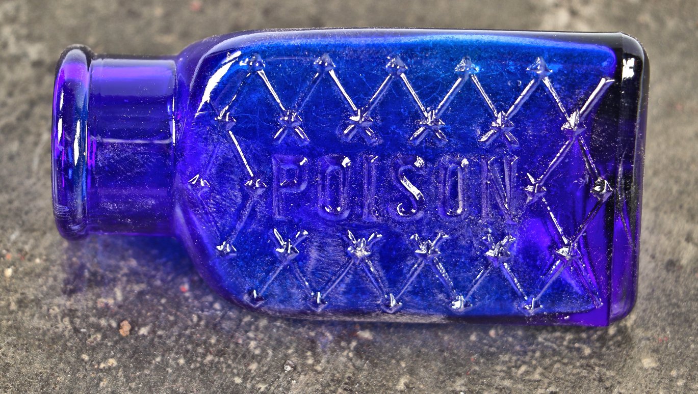 mint condition all original early twentieth century machine made deep cobalt blue 3-sided "poison" jar fabricated for the united drug company, of boston and st. louis