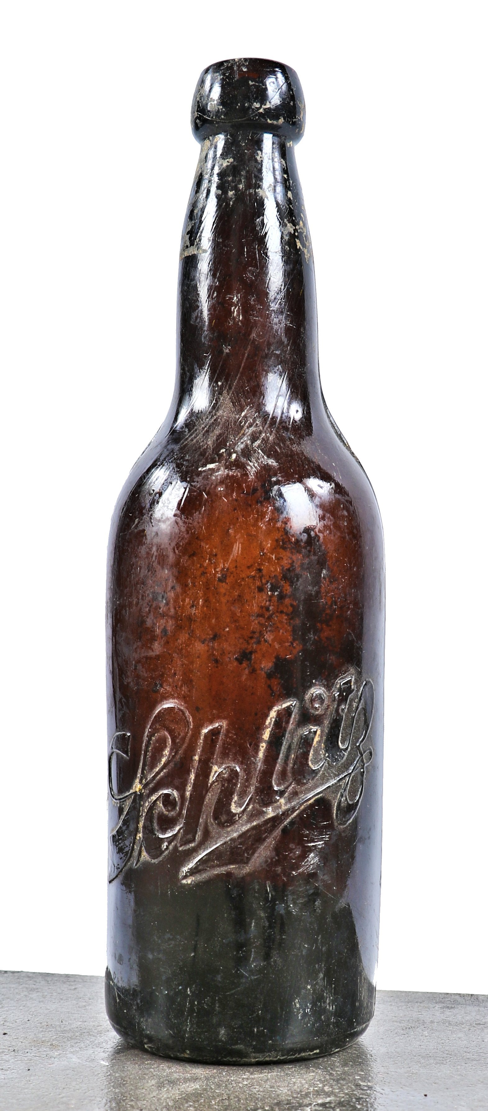 single late 19th or early 20th century amber glass embossed "schlitz" beer bottle fabricated in milwaukee, wi.