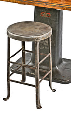 late 1920's antique american industrial brushed and sealed riveted joint angled steel factory machine shop stool with flared feet and channeled legs