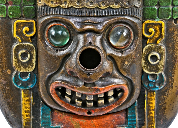 all original c. 1930's polychrome enameled ornamental cast iron mayan revival indian mask motif fisher theater interior illuminated seat end with glass jewels