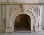 rare 1850's early american salvaged chicago carved alabama marble residential fireplace mantel with encircled bas-relief cherubs flanking oversized keystone