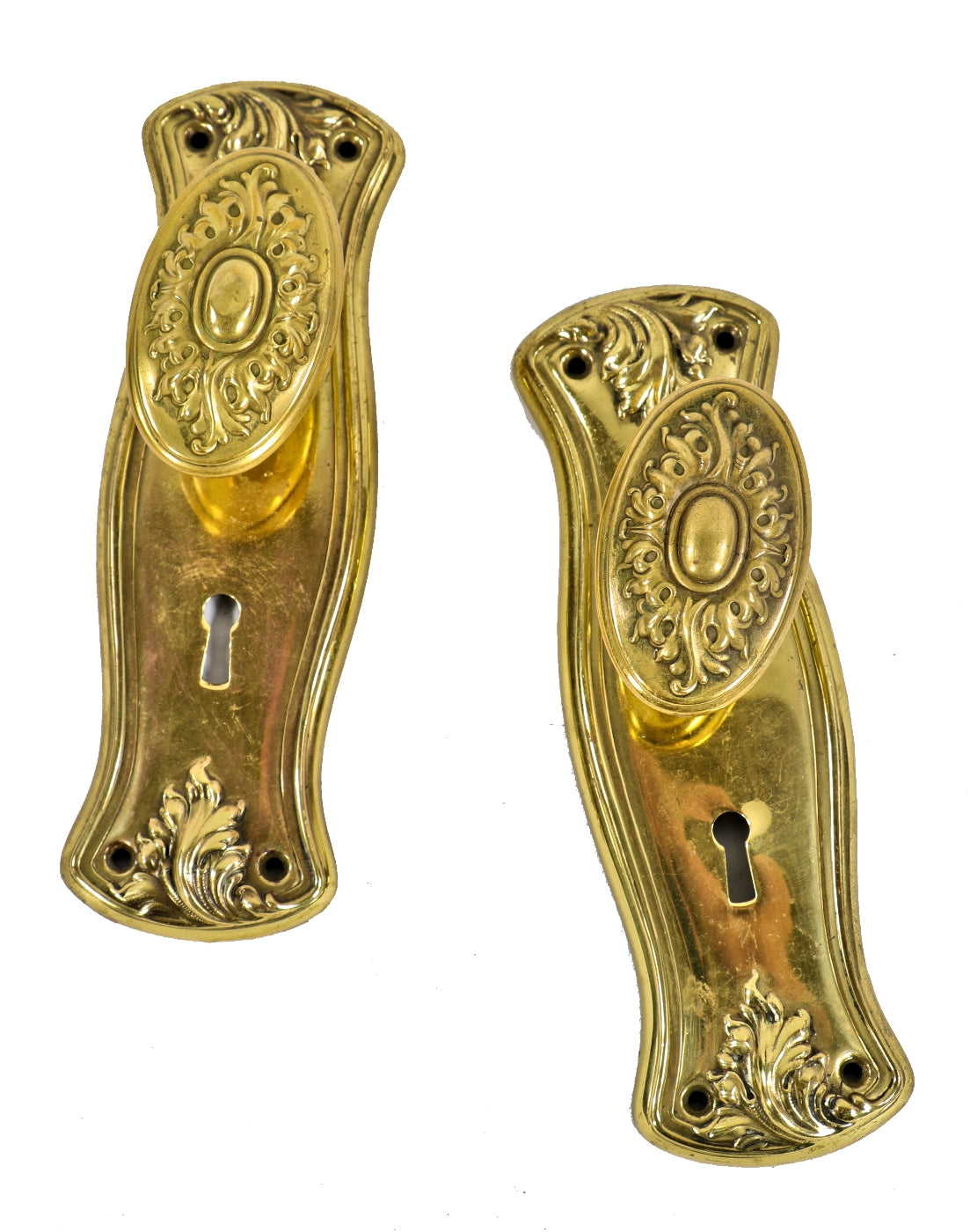 lot of matching all original early 20th century antique american stamped pressed brass interior residential backplates and oval-shaped doorknobs