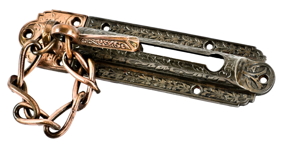 highly ornate 19th century antique american victorian cast iron entrance door chain bolt with partially intact copper-plated finish