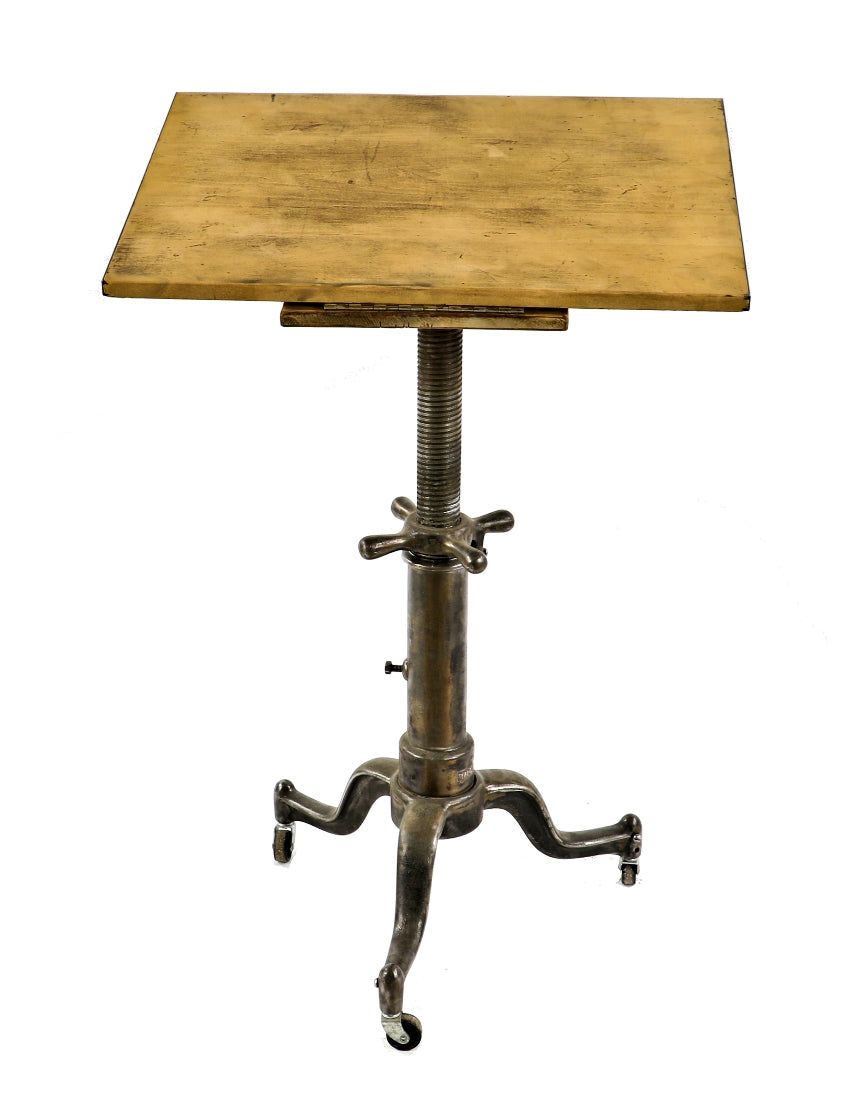 highly sought after all original and fully functional early 20th century refinished adjustable height mobile drawing table or stand with three-legged cast iron base
