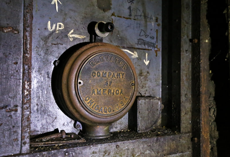 c. 1922 refinished cast iron and sold bronze salvaged chicago factory freight elevator hand switch case or cover with a mostly uniform brushed metal finish